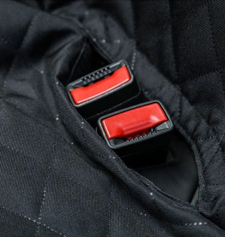 Seat belt openings in the quilted seat cover